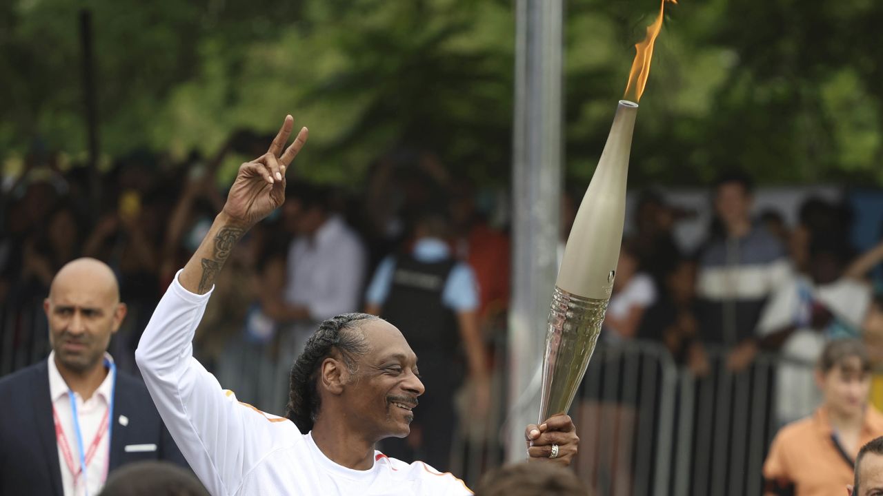 Snoop Dogg Carries the Olympic Torch Before 2024 Paris Games Common