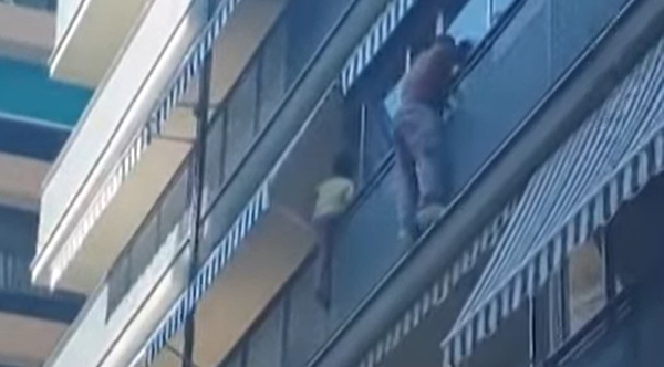 Heroic Worker Rescues Young Boy Dangling From Balcony