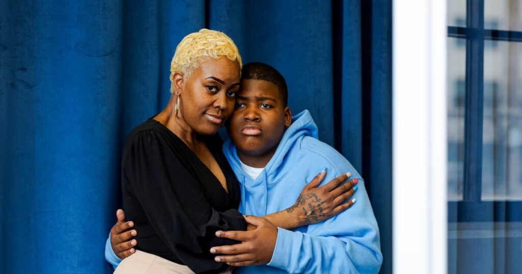 Sheri King and her son, George, pose for a portrait in Detroit.