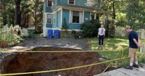 A massive sinkhole opened in Merrimon Avenue in 2019, which property owners unsuccessfully tried to fill in.