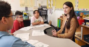 Tess Welles, a Wilkes-Barre senior, observes students in the classroom at Daniel J. Flood Elementary School.