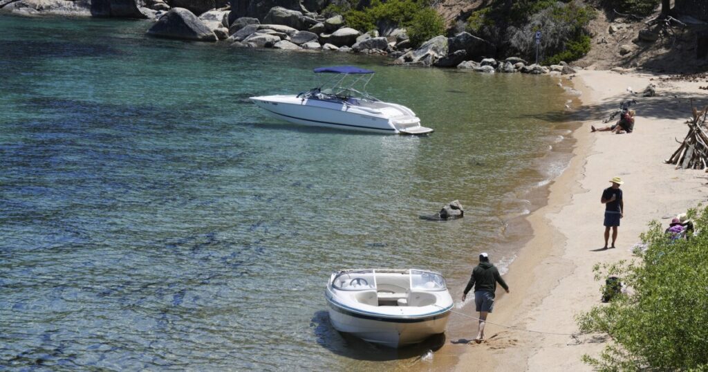 A boat out of the water and on a trailer.