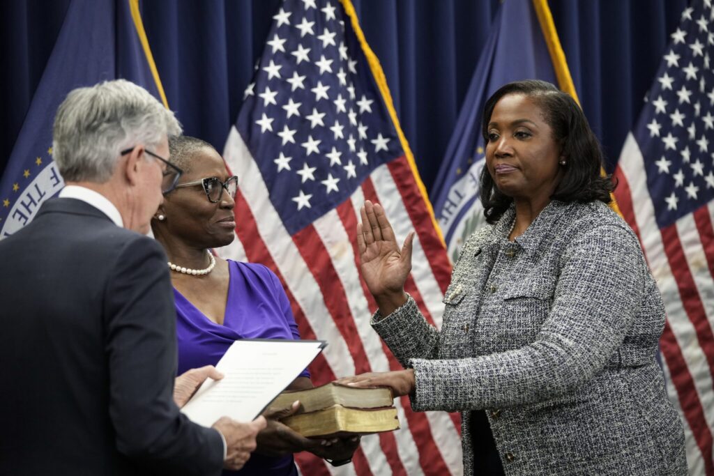 Chair of the Federal Reserve Jerome Powell, left, administers the oath of office to Lisa Cook, right, to serve as a member of the Board of Governors at the Federal Reserve System during a ceremony at the William McChesney Martin Jr. Building of the Federal Reserve May 23, 2022 in Washington, D.C. (Photo by Drew Angerer/Getty Images)