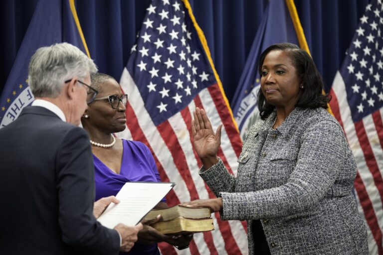 Chair of the Federal Reserve Jerome Powell, left, administers the oath of office to Lisa Cook, right, to serve as a member of the Board of Governors at the Federal Reserve System during a ceremony at the William McChesney Martin Jr. Building of the Federal Reserve May 23, 2022 in Washington, D.C. (Photo by Drew Angerer/Getty Images)