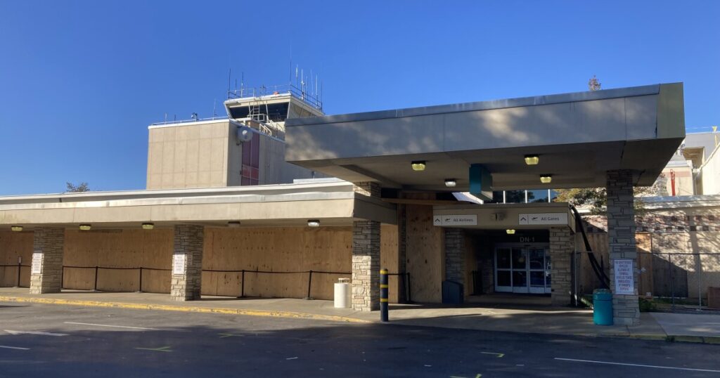 Passengers line up inside the ticketing area in Asheville Regional Airport's North Concourse Friday, October 17, 2025.