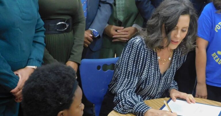 Gov. Whitmer signs education budget bill surrounded by Flint schoolchildren