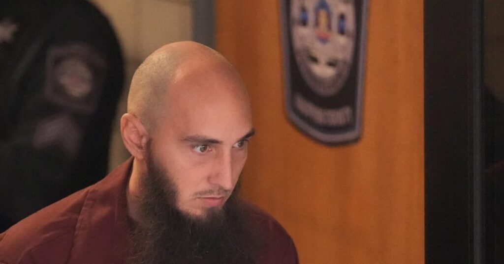 Investigators are seen outside the fire-damaged Pennsylvania governor's mansion Sunday morning, April 13, 2025 in Harrisburg.