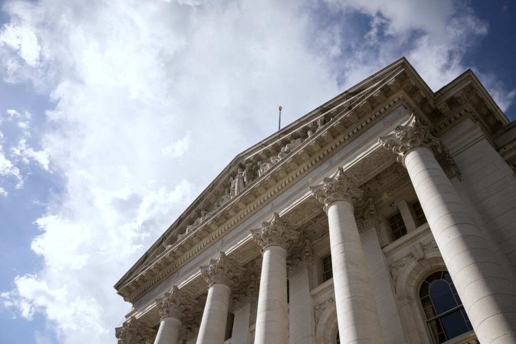 Clouds and a blue sky are seen behind the Wisconsin State Capitol