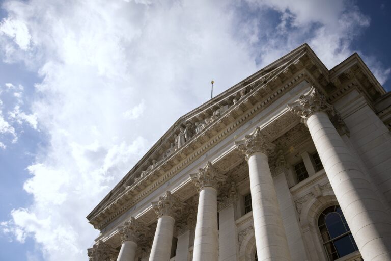 Clouds and a blue sky are seen behind the Wisconsin State Capitol