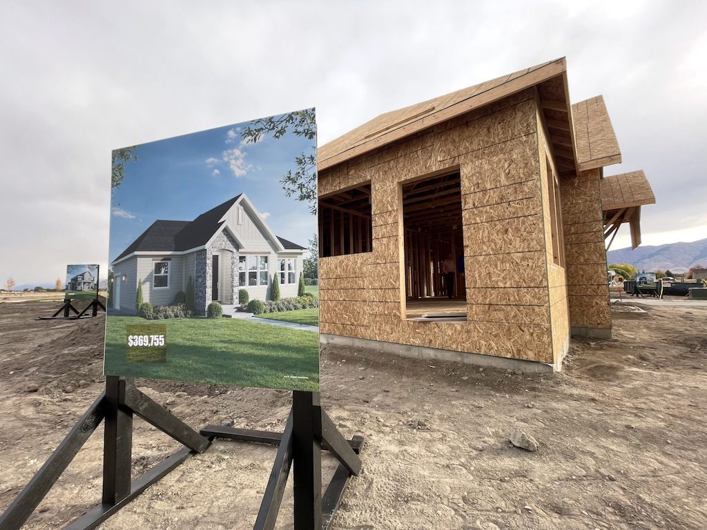 A rendering for a starter home being constructed sits on display during a groundbreaking ceremony for The Orchards at JDC Ranch in Utah.
