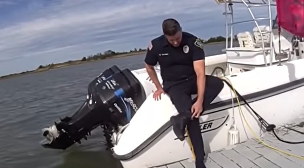 Police Officer Swims 100 Yards Against The Current To Rescue Injured Dog