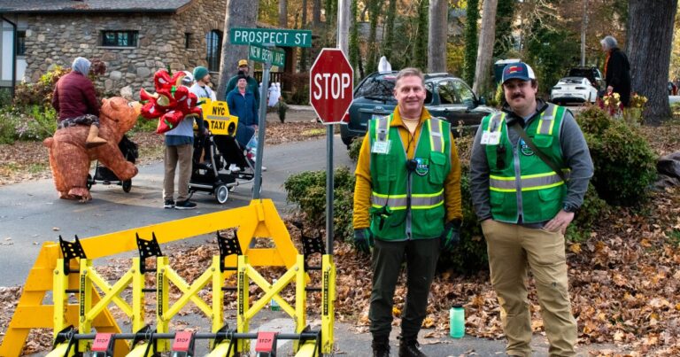 Volunteer Chris Kepler looks over the map of barricades and reunification tents that the group helped put together.