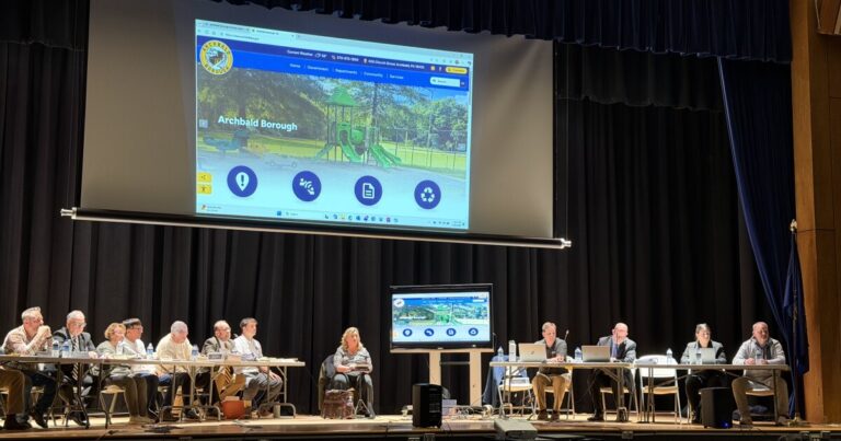 Lackawanna County Commissioner Bill Gaughan receives a standing ovation after speaking out against data centers in Archbald.