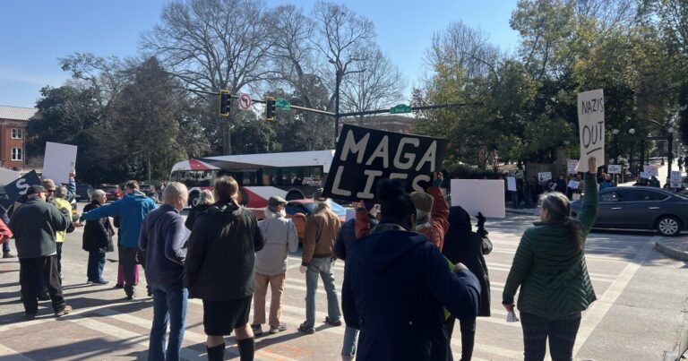 Athens residents rally to protest ICE tactics