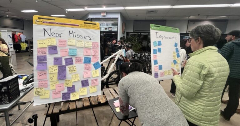 Griffin Tichenor stands near a display at Liberty Bicycles.