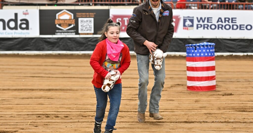 Rhys Benion of Carlisle rides a 'bronc' during the Exceptional Rodeo at the Pennsylvania Farm Show.