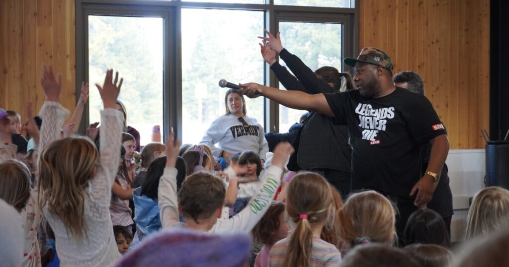 Performers, including local rapper Brandon Greathouse, known as GR8, dancers and members of the Arts for the Schools team pose for a group photo after a hip hop themed assembly at Tahoe Expedition Academy.