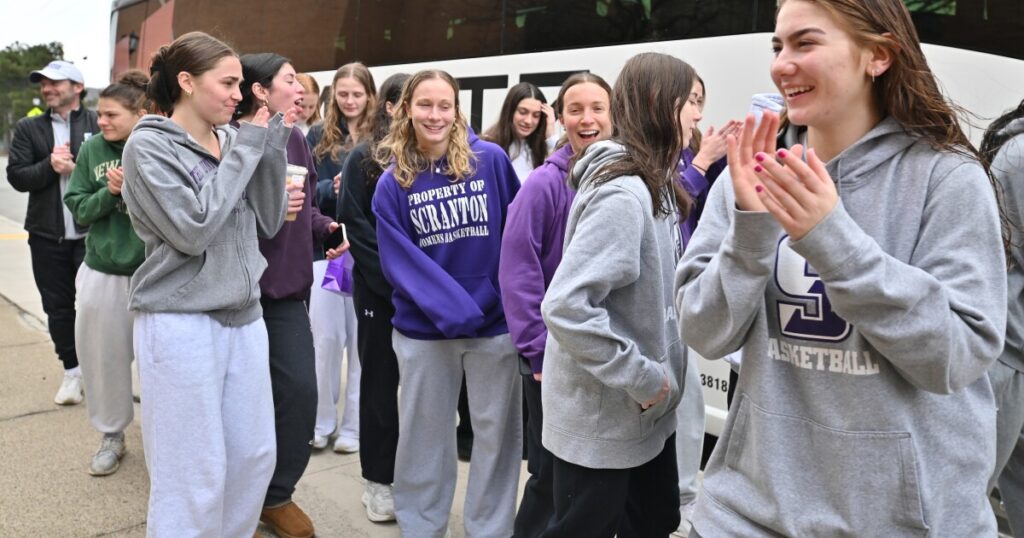 The University of Scranton women's basketball team and coaches pose for a photo before leaving for the Final Four.