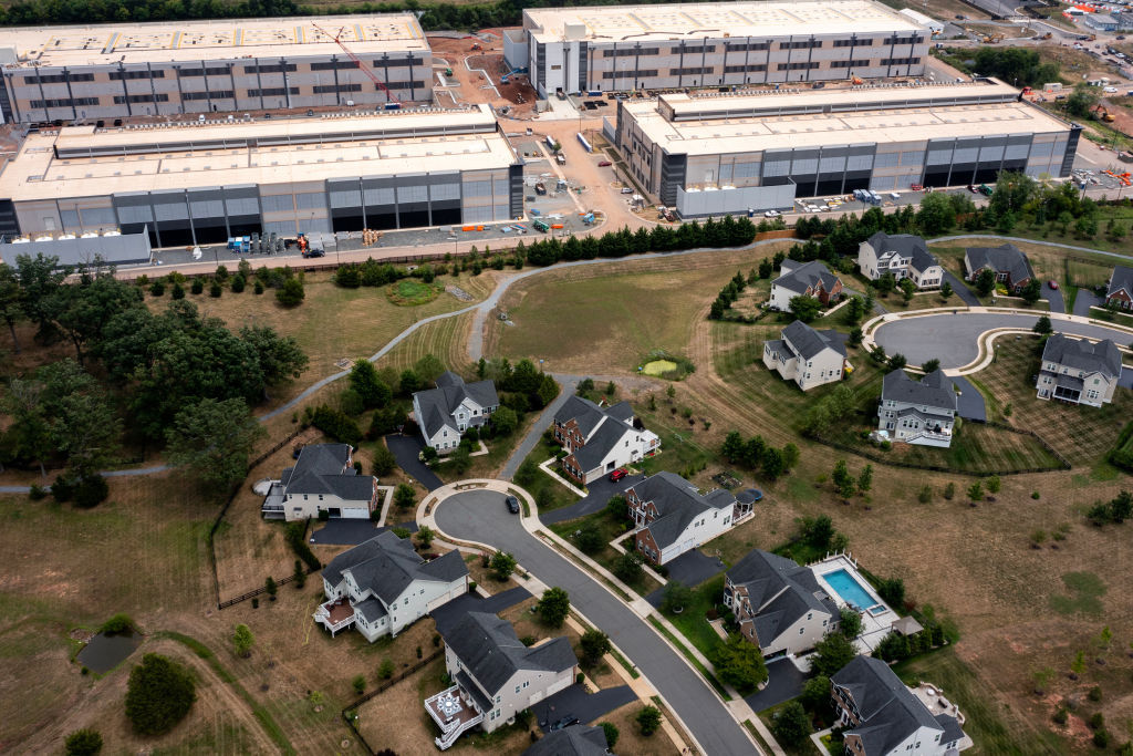 An Amazon Web Services data center is shown situated near single-family homes. Some local and state officials across the country want to halt development of the facilities. (Photo by Nathan Howard/Getty Images)