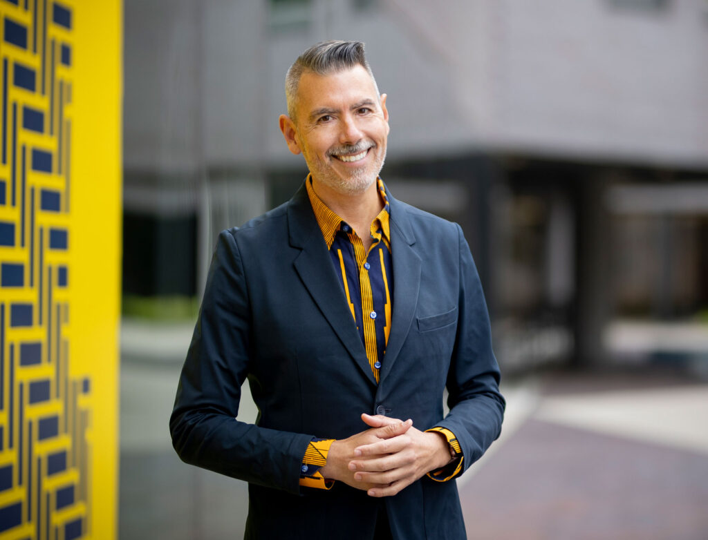 man standing in front of building