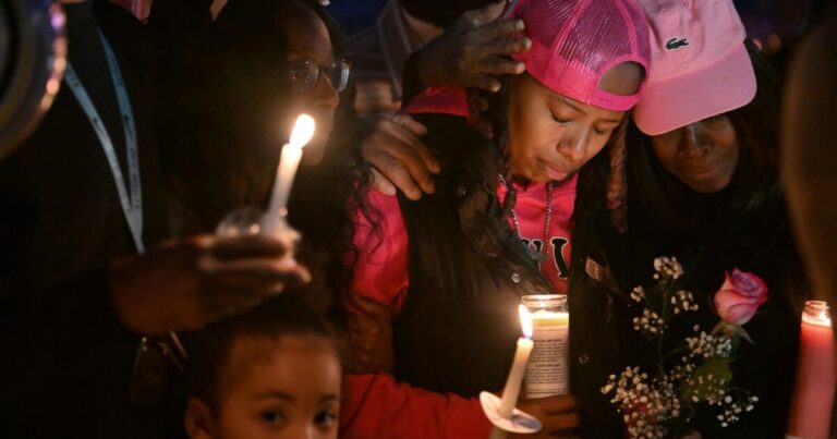 A large photo of La'Nyiah 'Lala' Clark with angel wings was set out for Saturday night's vigil in Wilkes-Barre.