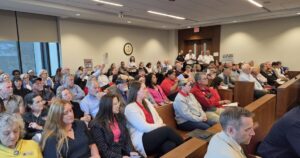 Over loud protests, Catawba County votes to merge school districts