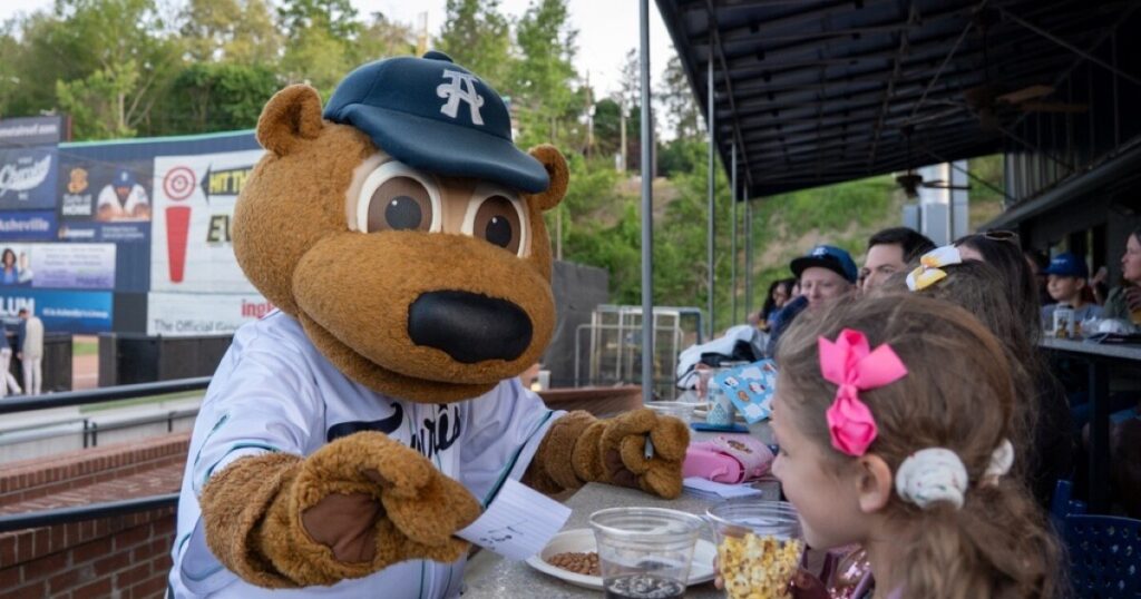Taylor Strange, Rebecca Strange, and Morris Anderson attended the Asheville Tourists' home opener at HomeTrust Park on April 21, 2026.