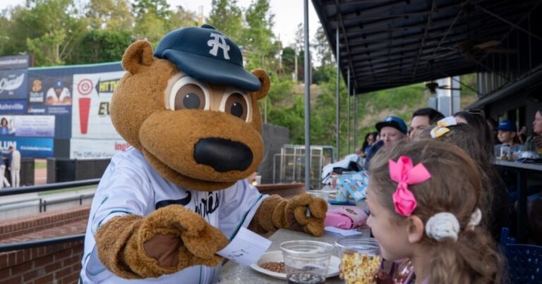 Taylor Strange, Rebecca Strange, and Morris Anderson attended the Asheville Tourists' home opener at HomeTrust Park on April 21, 2026.