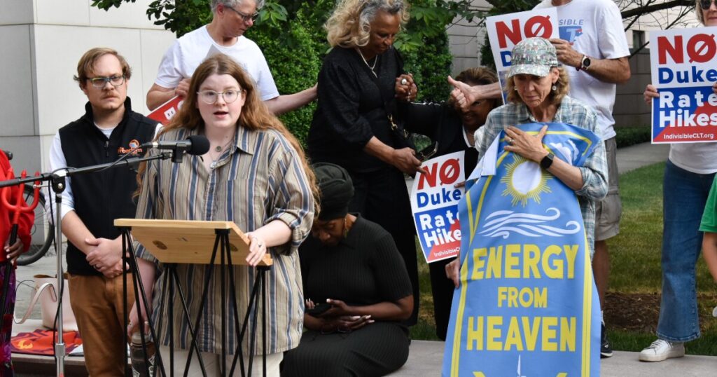 Reverend Amy Brooks Paradise protested "fossil fuels from hell" before Wednesday's public hearing.