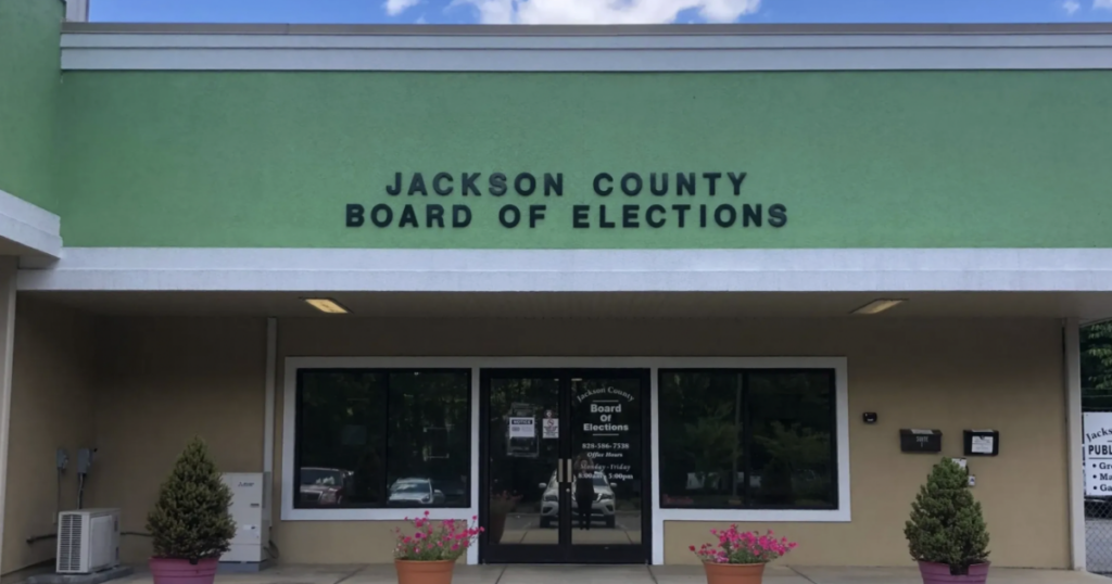A GOP Jackson County elections board member said he was warned against voting for a campus polling site