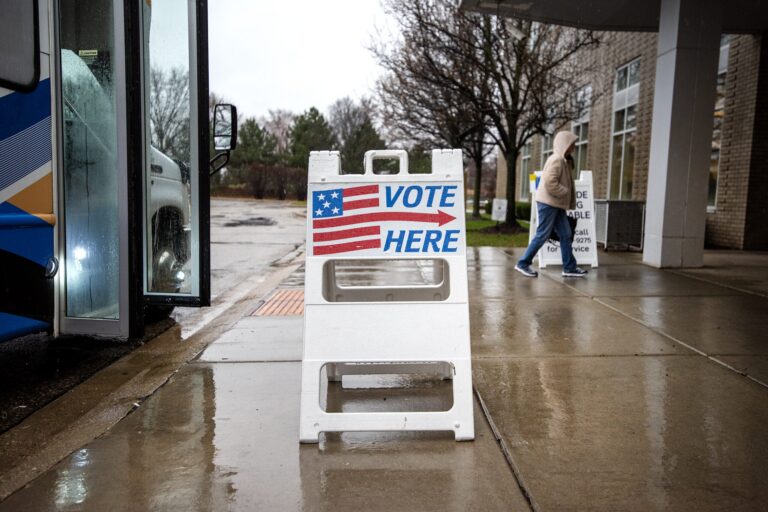 A sign with a US flag that says