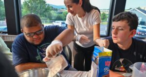 Inclusive Cooking Class Brings Skills and Joy to Community Participants - Common Good News University of Scranton speech-language pathology students instructed a cooking class to make red, white and blue pancakes.