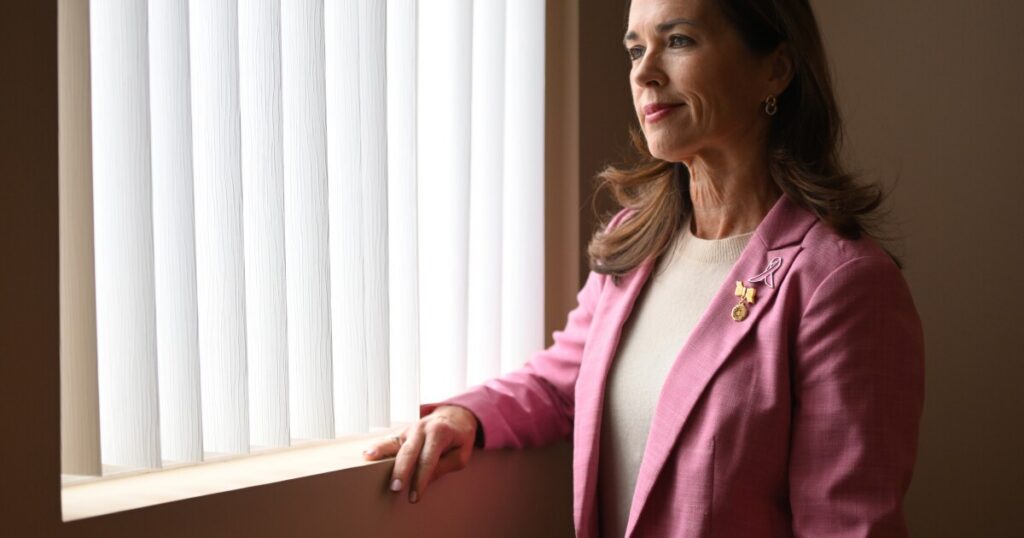 State Rep. Bridget Kosierowski added a breast cancer awareness pin above her state representative pin.