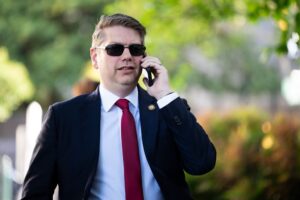 Nick Begich defended tariffs and outsourced jobs