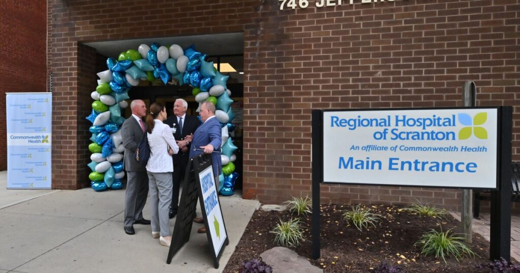 U.S. Rep. Rob Bresnahan, state Rep. Bridget Kosierowski and Scranton Mayor Paige Cognetti speak to Michael Clark, President of Commonwealth Health at Regional Hospital of Scranton, while Regional and Moses Taylor Hospitals CEO Dr. Patrick Conaboy listens.