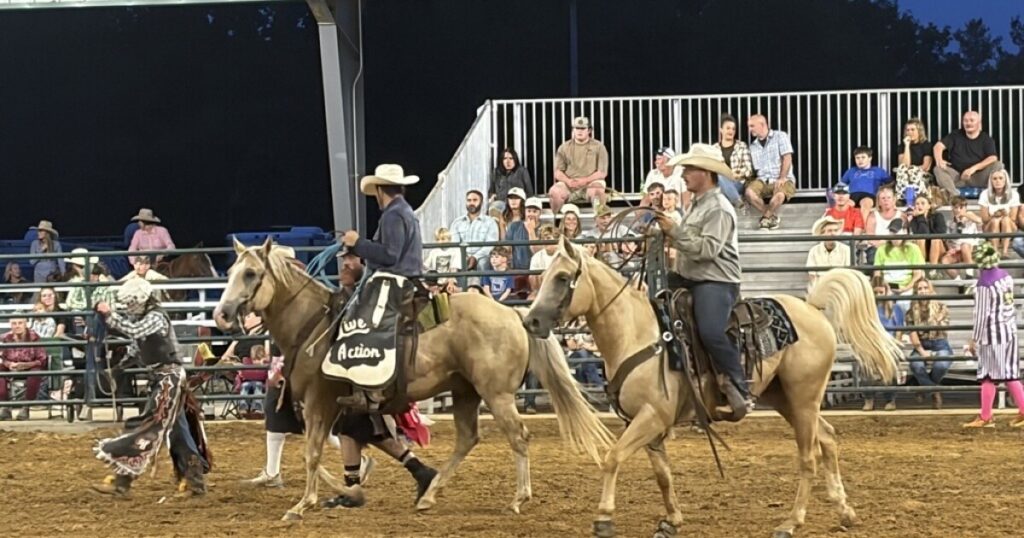 Bronco riders Kyle Thompson, left, with Adam Hawkenberry.