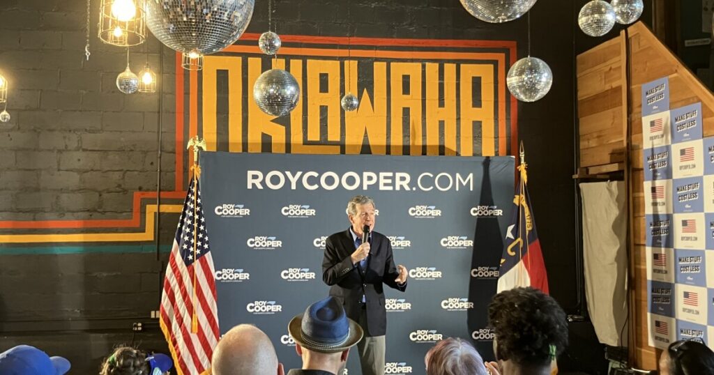 Members of the audience listen during Democratic Senate nominee Roy Cooper's event at Oklawaha Brewing Co. in Hendersonville Thursday, Aug. 20, 2026.