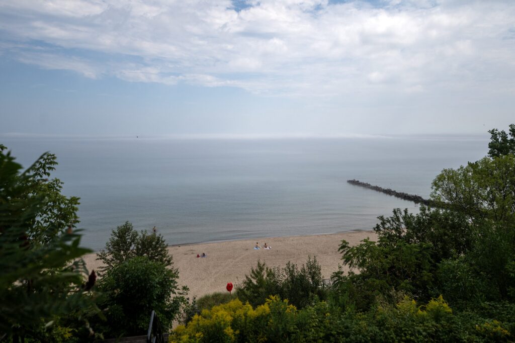 A sandy beach with private property signs