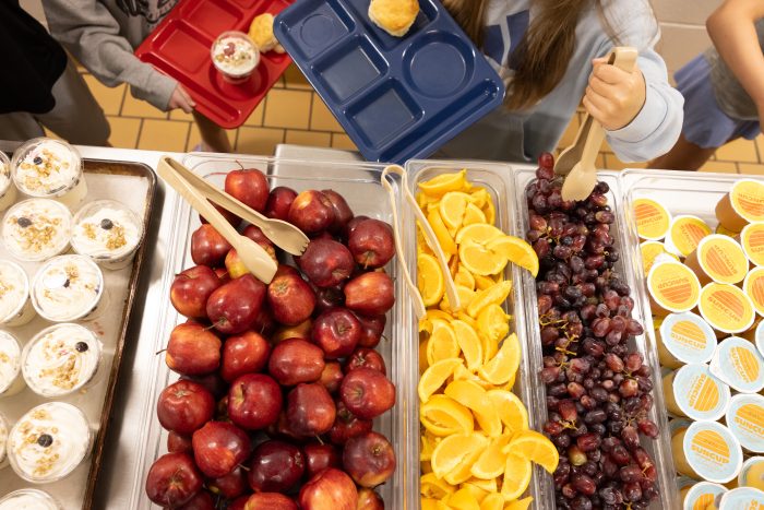 Elementary school kids go through the lunch line. Cuts to the nation’s largest food assistance program may cause students to lose access to free breakfast and lunch. (Photo by Marcus Constantino for West Virginia Watch)